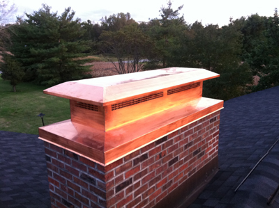 Before and after chimney cap replacement in Port Washington, NY