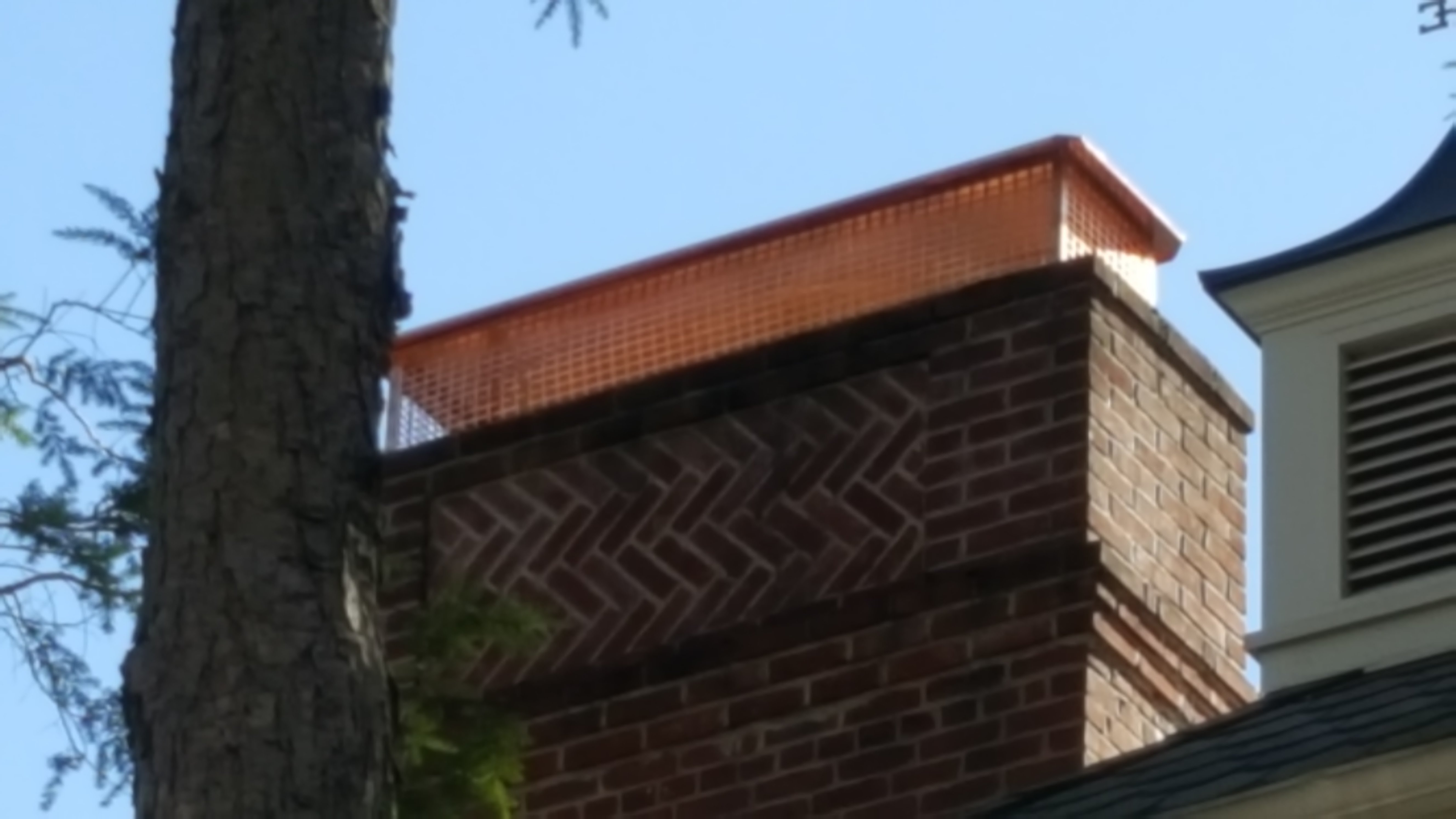 New stainless steel chimney cap installed in Port Washington, NY