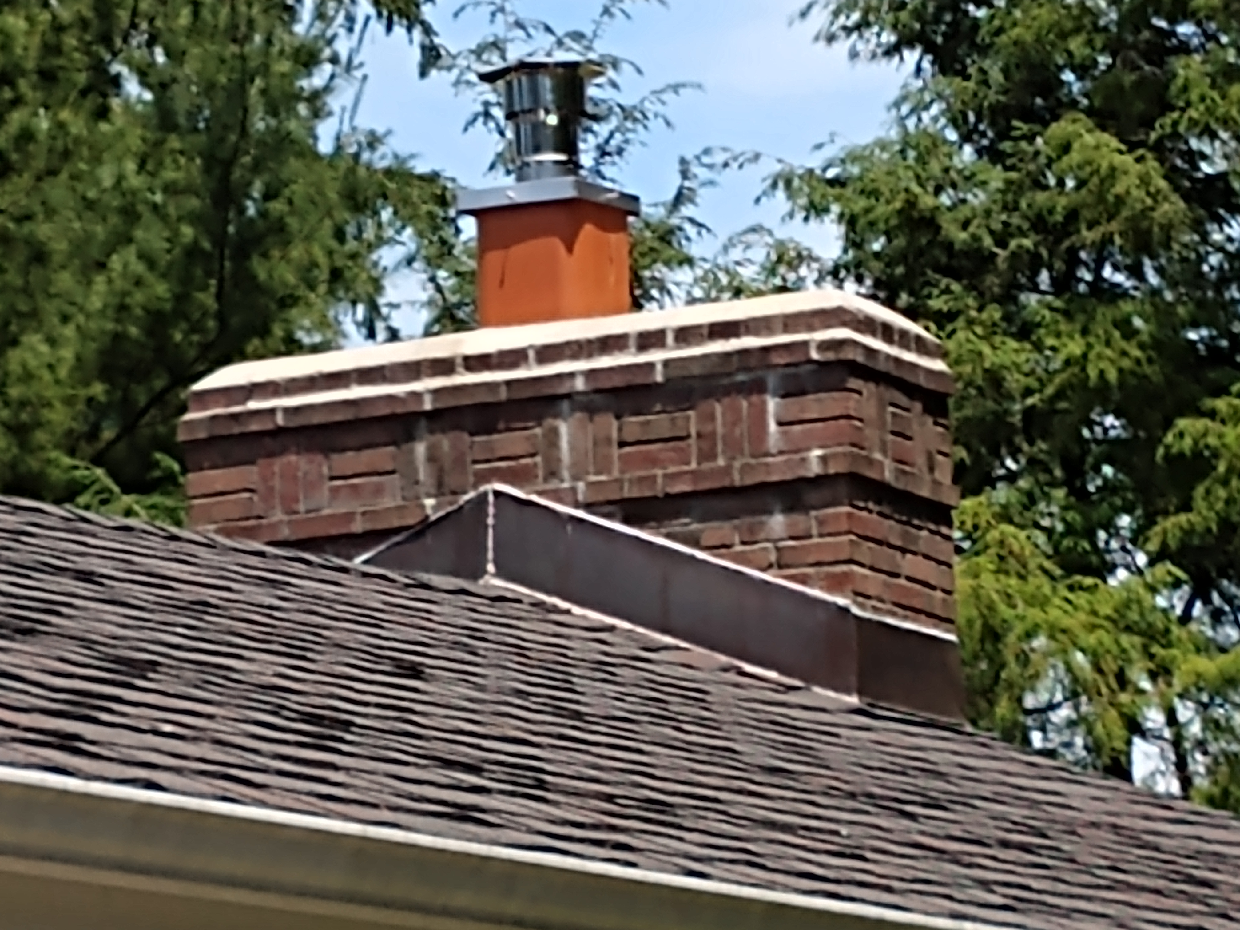 Stainless steel chimney cap with animal guard in Port Washington, New York